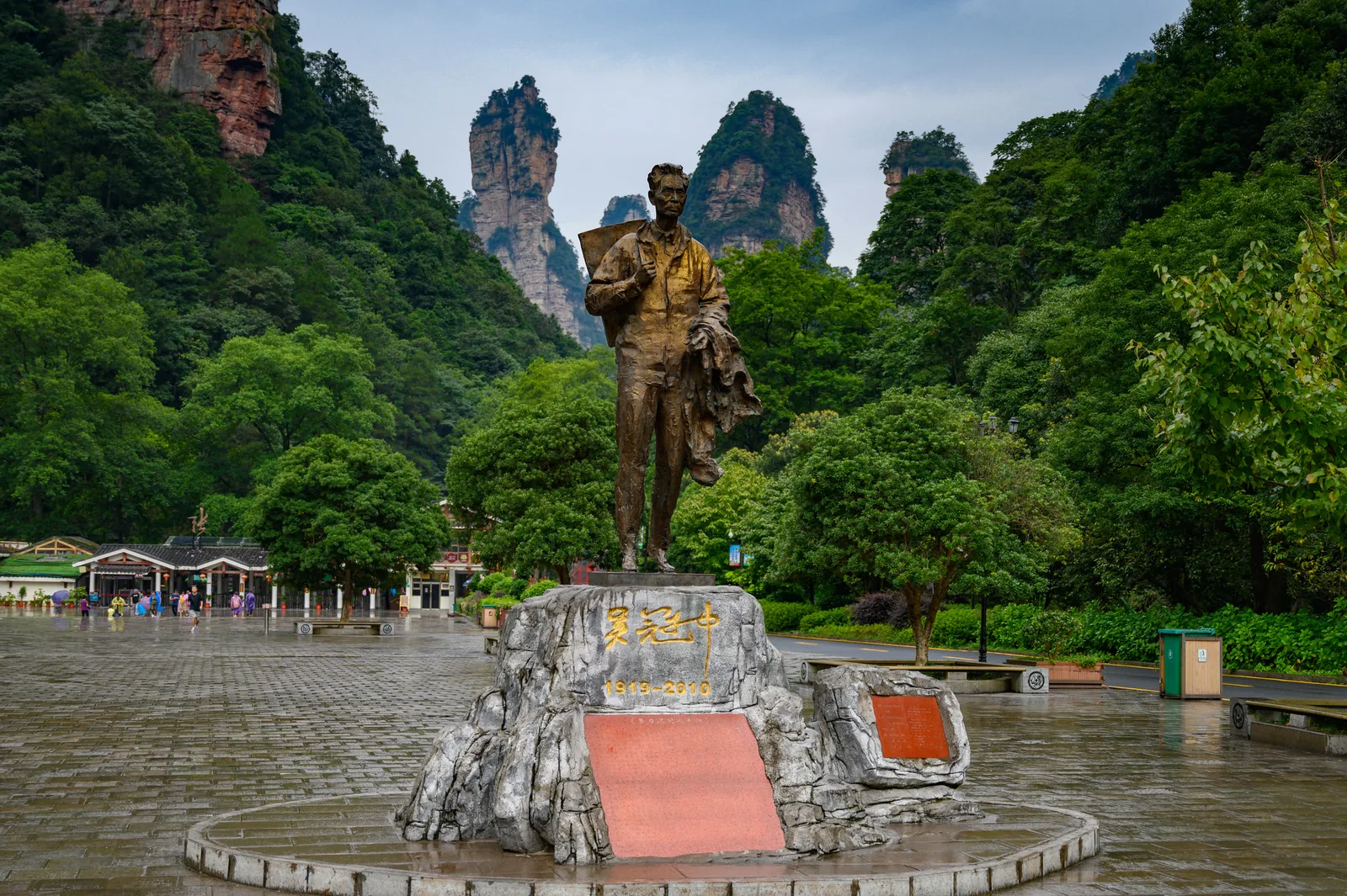 Statue and forested sandstone peaks in Zhangjiajie National Forest Park