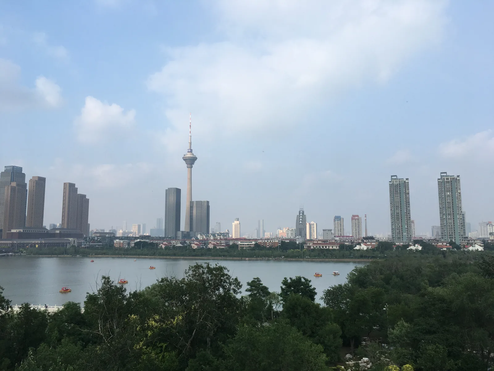 Tianjin skyline across the lake in Tianjin Water Park